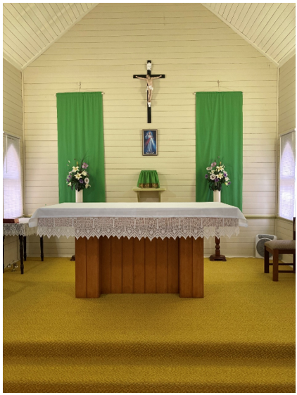 Former St Peter's Catholic Church Crucifix behind the altar at St John's 